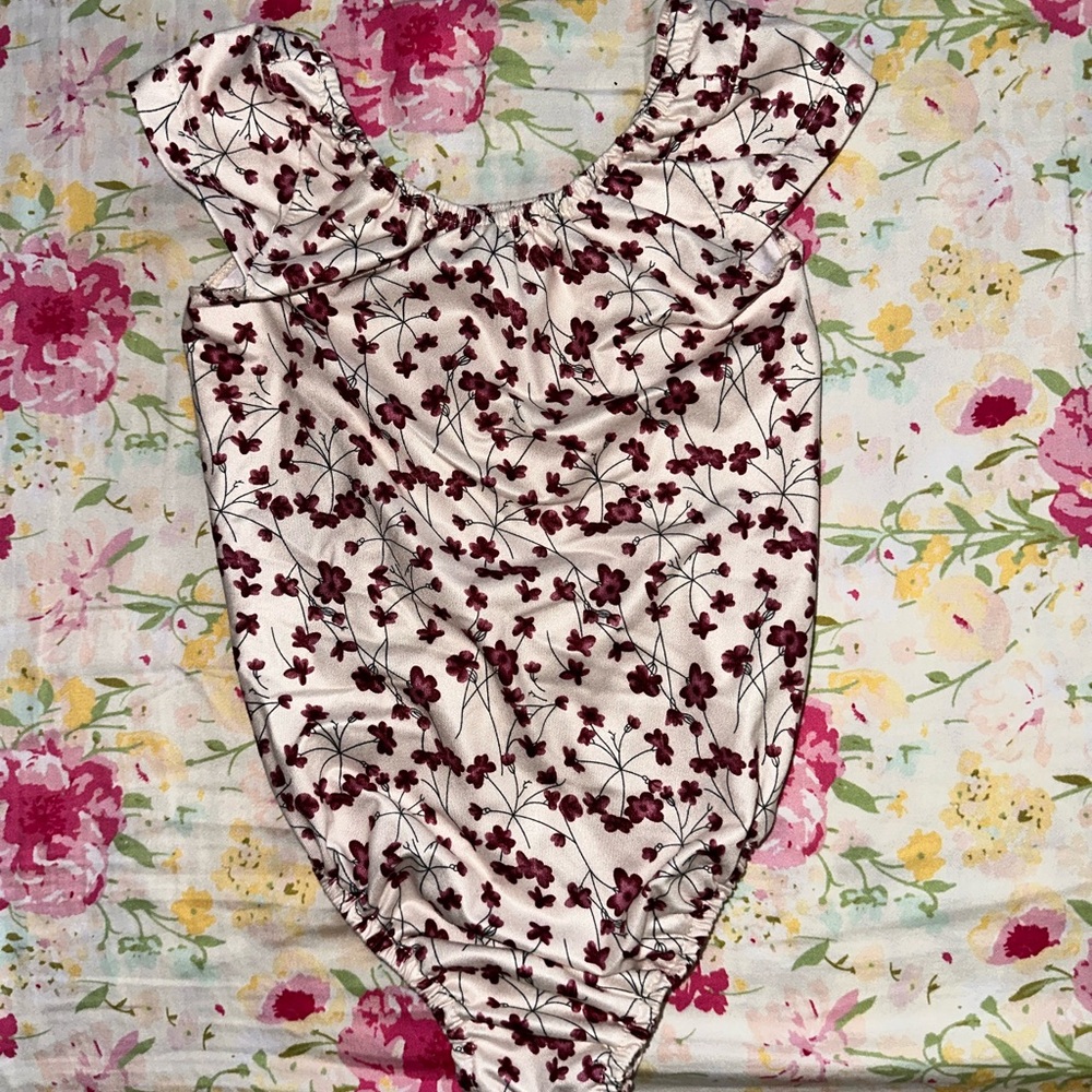 Two Bailey’s Blossoms bodysuits
